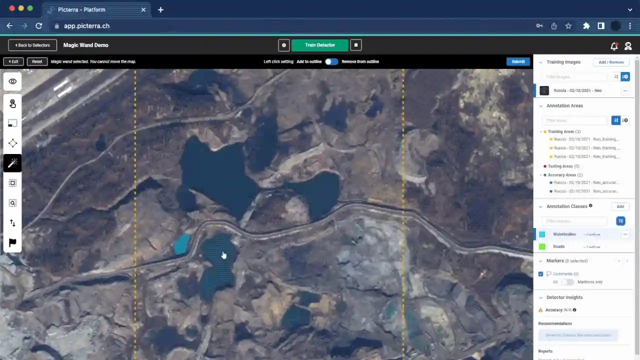 This image features the Picterra "Magic Wand" tool, an AI-powered annotation feature that significantly accelerates the model training process. The screenshot shows the tool being used to identify and select waterbodies within a rugged, industrial landscape. Powered by Meta AI’s Segment Anything Model (SAM), the Magic Wand allows users to click on an object of interest—in this case, a dark pool of water—and automatically generates a precise polygon outline.